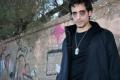2472283-young-man-in-gothic-look-lying-on-a-wall
